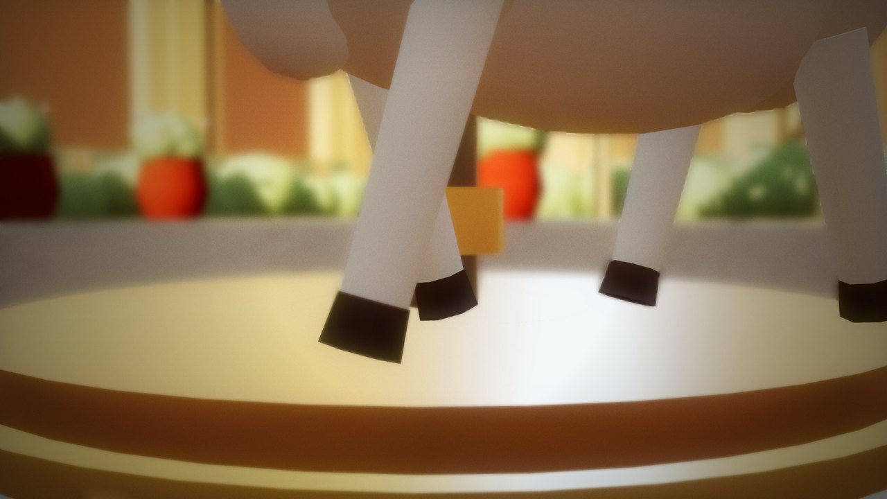 Close-up of the wooden cow's hooves hovering above the copper disc